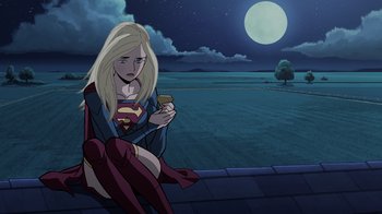 Movie still from “Legion of Super-Heroes” (2023), directed by Jeff Wamester – A woman sitting on the side of a building holding a cell phone; Medium shot, Low angle