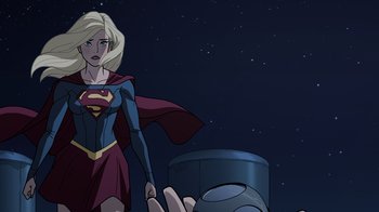 Movie still from “Legion of Super-Heroes” (2023), directed by Jeff Wamester – A woman in a red and blue dress is standing next to a man in a blue and red suit; Medium shot, Over the shoulder angle