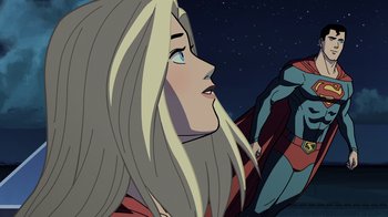 Movie still from “Legion of Super-Heroes” (2023), directed by Jeff Wamester – A woman with long blonde hair looking up at the sky; Medium shot, Over the shoulder angle