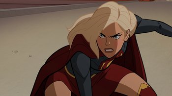 Movie still from “Legion of Super-Heroes” (2023), directed by Jeff Wamester – A blonde haired woman in a red and black outfit; Close Up shot, Overhead angle