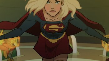 Movie still from “Legion of Super-Heroes” (2023), directed by Jeff Wamester – A woman in a red and blue dress is standing in a room; Medium shot, Over the shoulder angle