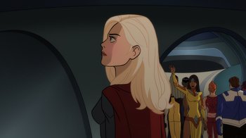 Movie still from “Legion of Super-Heroes” (2023), directed by Jeff Wamester – A woman with long blonde hair is looking off into the distance; Close Up shot, Over the shoulder angle
