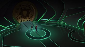 Movie still from “Legion of Super-Heroes” (2023), directed by Jeff Wamester – Two people standing in a circle in front of a green wall; Extreme Wide shot, High angle