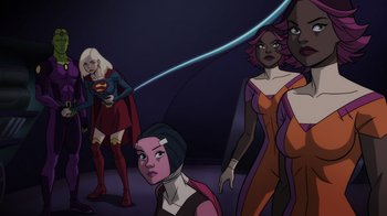 Movie still from “Legion of Super-Heroes” (2023), directed by Jeff Wamester – A group of women standing next to each other in a room; Medium shot, Over the shoulder angle