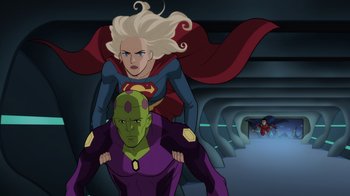 Movie still from “Legion of Super-Heroes” (2023), directed by Jeff Wamester – A woman and a man are standing next to each other; Medium shot, Over the shoulder angle