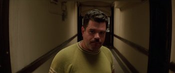 Movie still from “Léon: The Professional” (1994), directed by Luc Besson – A person wearing a yellow shirt; Close Up shot, Low angle