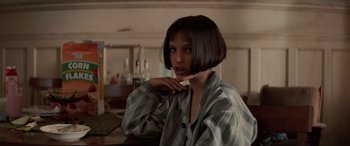 Movie still from “Léon: The Professional” (1994), directed by Luc Besson – A woman with short brown hair is posing for a picture; Close Up shot, Low angle