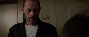 Movie still from “Léon: The Professional” (1994), directed by Luc Besson – A person wearing a jacket; Close Up shot, Low angle