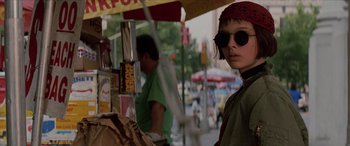 Movie still from “Léon: The Professional” (1994), directed by Luc Besson – A person wearing sunglasses and a red bandana; Close Up shot, Low angle