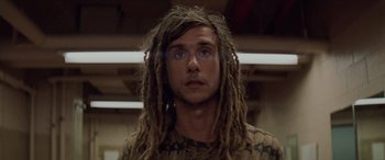 Movie still from “Léon: The Professional” (1994), directed by Luc Besson – A man with dreads is looking into the camera; Close Up shot, Low angle