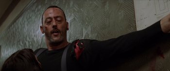 Movie still from “Léon: The Professional” (1994), directed by Luc Besson – A person wearing a tie; Close Up shot, Low angle