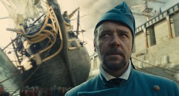 Movie still from “Les Misérables” (2012), directed by Tom Hooper – A person wearing a hat; Close Up shot, Low angle