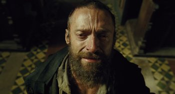 Movie still from “Les Misérables” (2012), directed by Tom Hooper – A person with a beard; Close Up shot, Low angle