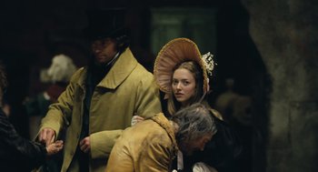 Movie still from “Les Misérables” (2012), directed by Tom Hooper – A man and a woman dressed in period clothing; Medium shot, Over the shoulder angle