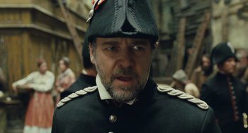 Movie still from “Les Misérables” (2012), directed by Tom Hooper – A person wearing a uniform; Close Up shot, Low angle