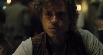 Movie still from “Les Misérables” (2012), directed by Tom Hooper – A person with curly hair; Close Up shot, Over the shoulder angle