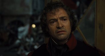 Movie still from “Les Misérables” (2012), directed by Tom Hooper – A person with curly hair; Close Up shot, Low angle