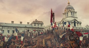 Movie still from “Les Misérables” (2012), directed by Tom Hooper – A group of people standing on top of a pile of rubble; Extreme Wide shot, High angle
