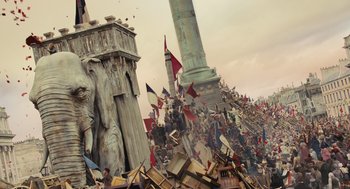 Movie still from “Les Misérables” (2012), directed by Tom Hooper – A crowd of people standing next to each other on top of a building; Extreme Wide shot, High angle