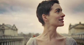 Movie still from “Les Misérables” (2012), directed by Tom Hooper – A person with short hair looking up; Close Up shot, Low angle