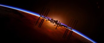 Movie still from “Life” (2017), directed by Daniel Espinosa – A view of the earth from the space station at sunset; Extreme Wide shot, Overhead angle