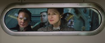Movie still from “Life” (2017), directed by Daniel Espinosa – A woman is looking out of a train window; Close Up shot, Over the shoulder angle