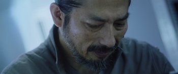 Movie still from “Life” (2017), directed by Daniel Espinosa – A person with a beard; Extreme Close Up shot, Low angle