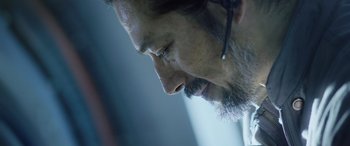 Movie still from “Life” (2017), directed by Daniel Espinosa – A person wearing a headset; Close Up shot, Low angle