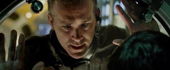 Movie still from “Life” (2017), directed by Daniel Espinosa – A person wearing a headset; Close Up shot, Over the shoulder angle