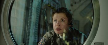 Movie still from “Life” (2017), directed by Daniel Espinosa – A woman in a uniform is looking into the distance; Close Up shot, Low angle