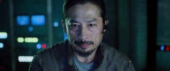 Movie still from “Life” (2017), directed by Daniel Espinosa – A person wearing a headset; Close Up shot, Low angle