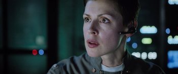 Movie still from “Life” (2017), directed by Daniel Espinosa – A person wearing a headset; Close Up shot, Low angle