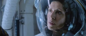 Movie still from “Life” (2017), directed by Daniel Espinosa – A woman wearing a space suit and a helmet; Close Up shot, Low angle