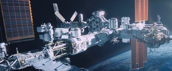 Movie still from “Life” (2017), directed by Daniel Espinosa – An image of a space station in the middle of the night; Extreme Wide shot, Overhead angle