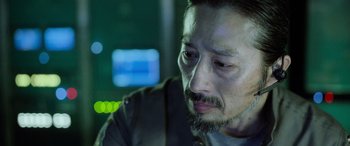 Movie still from “Life” (2017), directed by Daniel Espinosa – A person with a beard; Close Up shot, Low angle