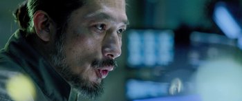 Movie still from “Life” (2017), directed by Daniel Espinosa – A person with a beard; Close Up shot, Over the shoulder angle