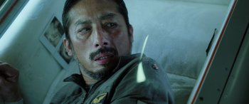 Movie still from “Life” (2017), directed by Daniel Espinosa – A person wearing a jacket; Close Up shot, Low angle