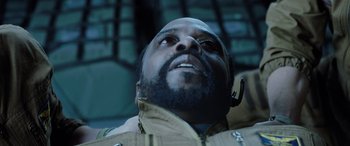 Movie still from “Life” (2017), directed by Daniel Espinosa – A person looking up at the sky; Close Up shot, Overhead angle