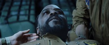 Movie still from “Life” (2017), directed by Daniel Espinosa – A person with a beard; Close Up shot, Overhead angle