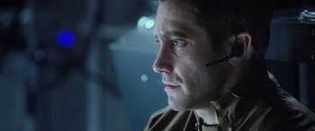Movie still from “Life” (2017), directed by Daniel Espinosa – A person wearing a headset; Close Up shot, Over the shoulder angle