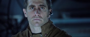 Movie still from “Life” (2017), directed by Daniel Espinosa – A person wearing a headset; Close Up shot, Low angle
