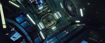 Movie still from “Life” (2017), directed by Daniel Espinosa – Looking down at the interior of an industrial building; Extreme Wide shot, Overhead angle