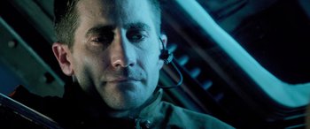 Movie still from “Life” (2017), directed by Daniel Espinosa – A person wearing a headset; Close Up shot, Over the shoulder angle