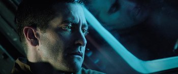 Movie still from “Life” (2017), directed by Daniel Espinosa – A man's face in a car; Close Up shot, Low angle