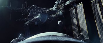 Movie still from “Life” (2017), directed by Daniel Espinosa – A view of a space station from a space ship; Extreme Wide shot, Overhead angle