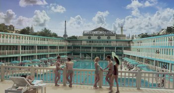 Movie still from “Life of Pi” (2012), directed by Ang Lee – A group of people standing next to each other near a swimming pool; Extreme Wide shot, High angle