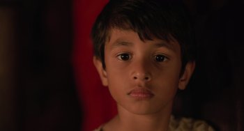 Movie still from “Life of Pi” (2012), directed by Ang Lee – A young boy's face; Close Up shot, Over the shoulder angle