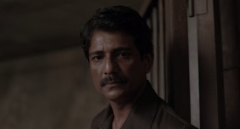 Movie still from “Life of Pi” (2012), directed by Ang Lee – A person with a mustache; Close Up shot, Low angle