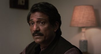 Movie still from “Life of Pi” (2012), directed by Ang Lee – A person with a beard and mustache; Close Up shot, Low angle