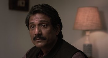 Movie still from “Life of Pi” (2012), directed by Ang Lee – A person wearing a vest; Close Up shot, Low angle